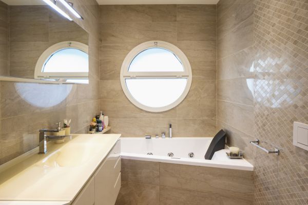Circular Window Installation in The Colony